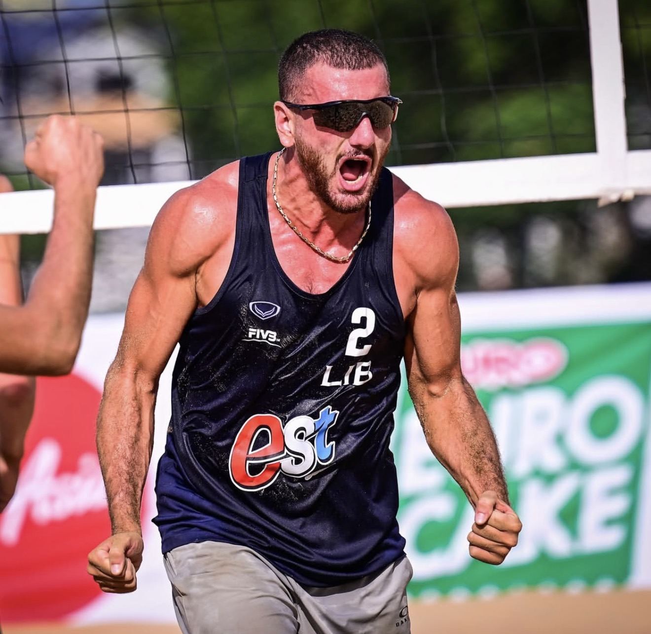 Omar Abi Karam roaring after a point for Lebanon on the sand