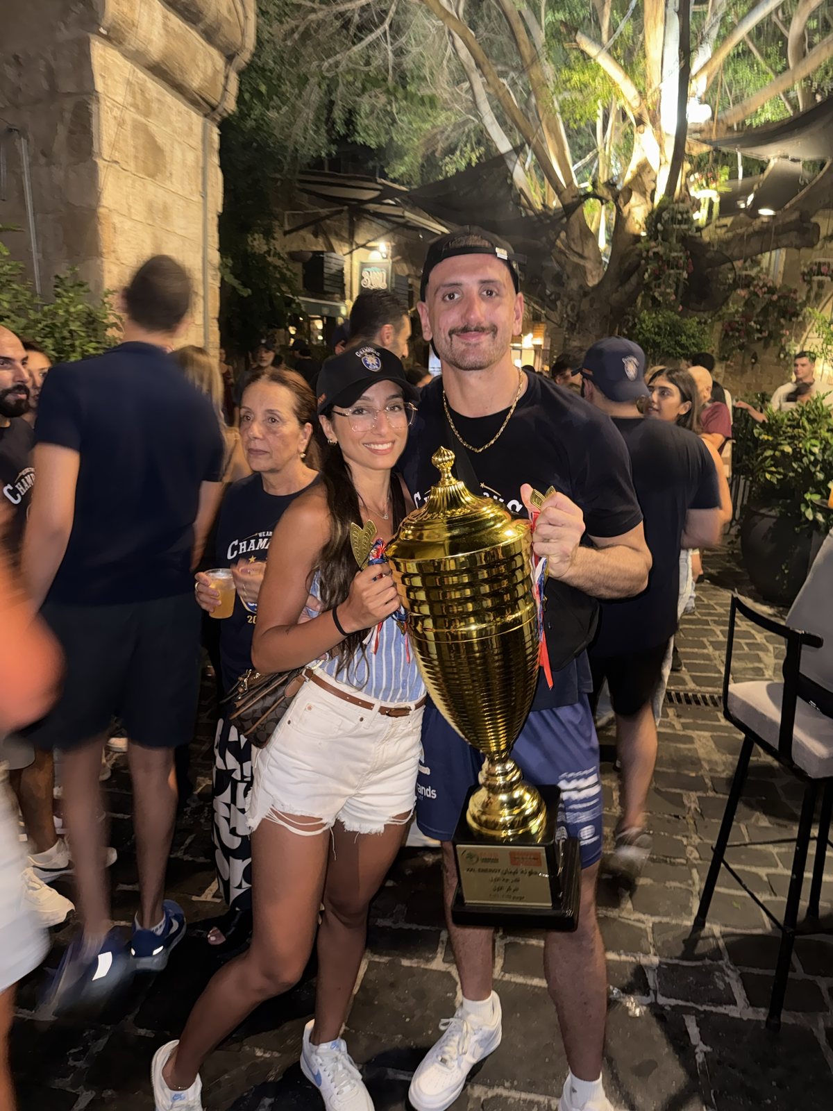 Omar holding the Lebanese first division trophy on title night in Batroun